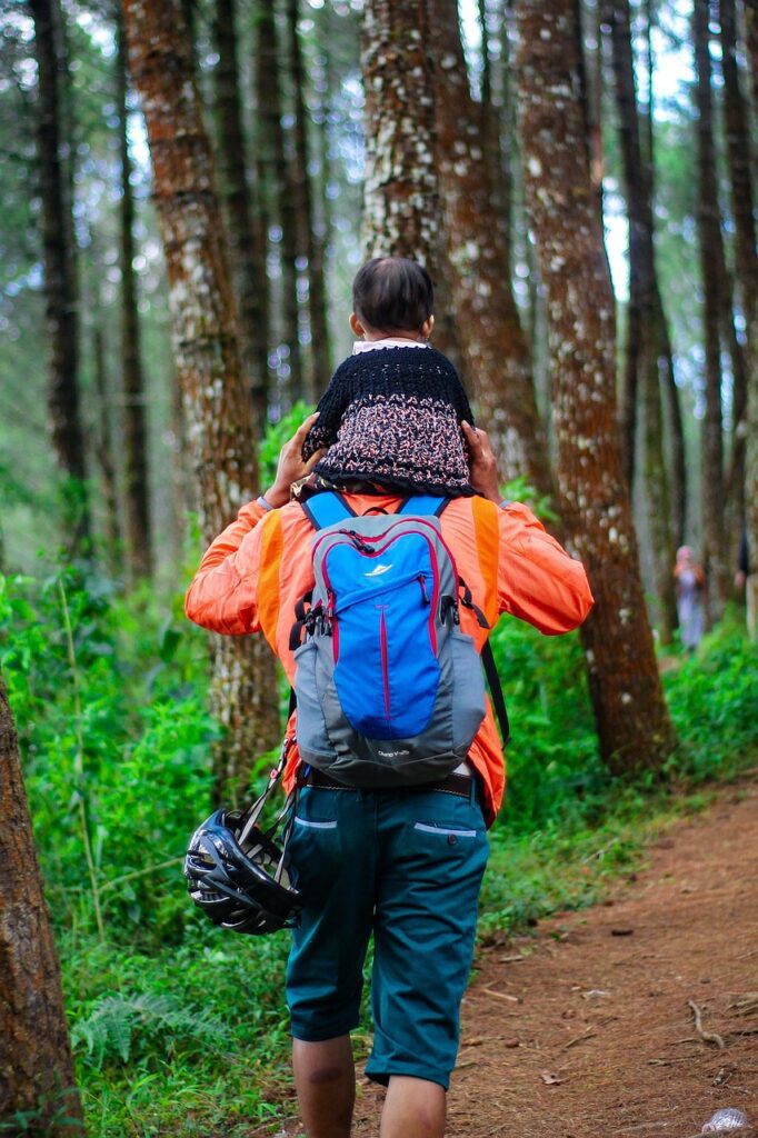 man and child, hiking, forest. Parenting tips for active kids
