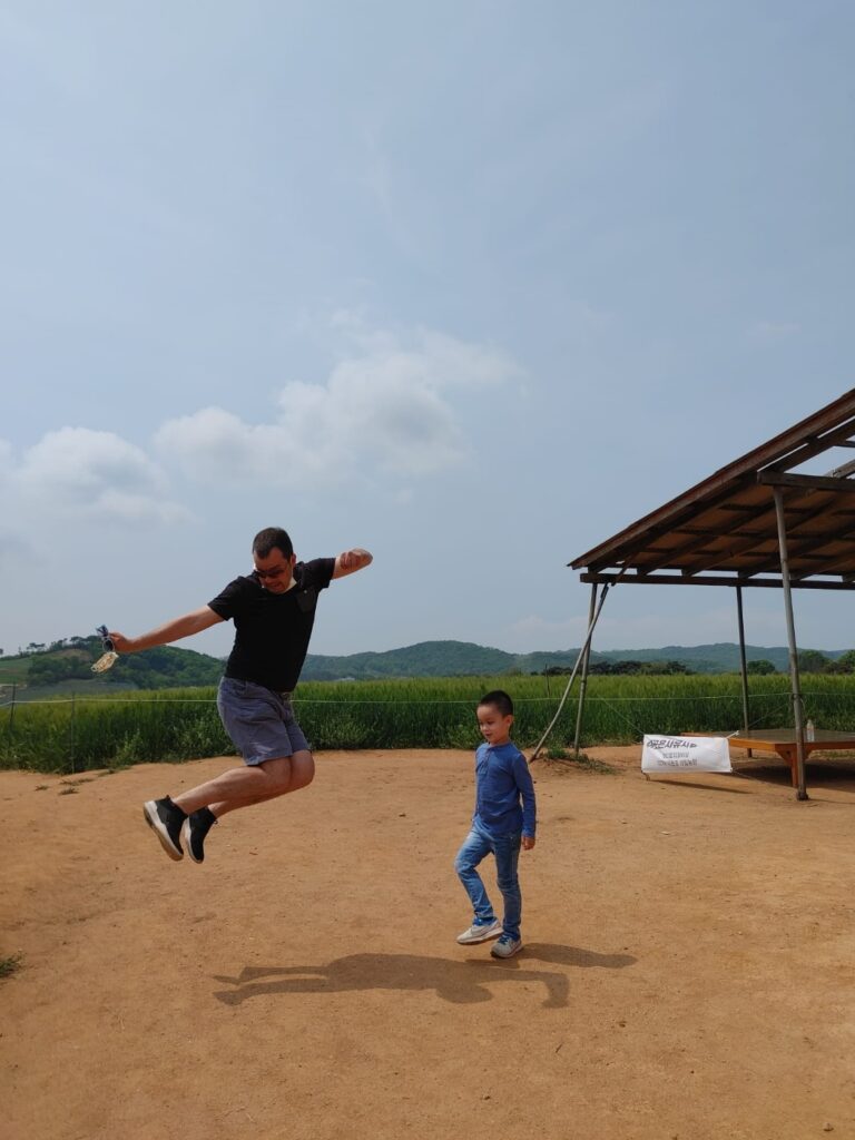father jumping happily