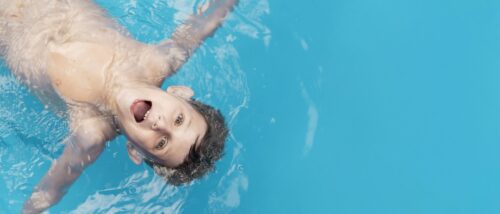 Boy having fun swimming