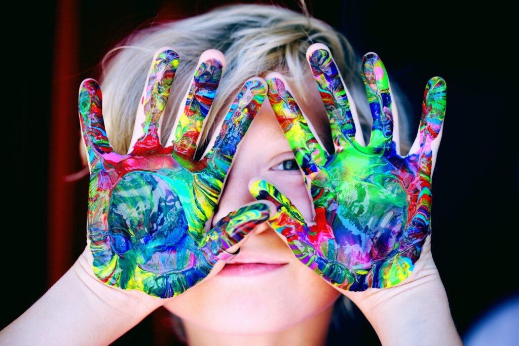 Kid with painted hands