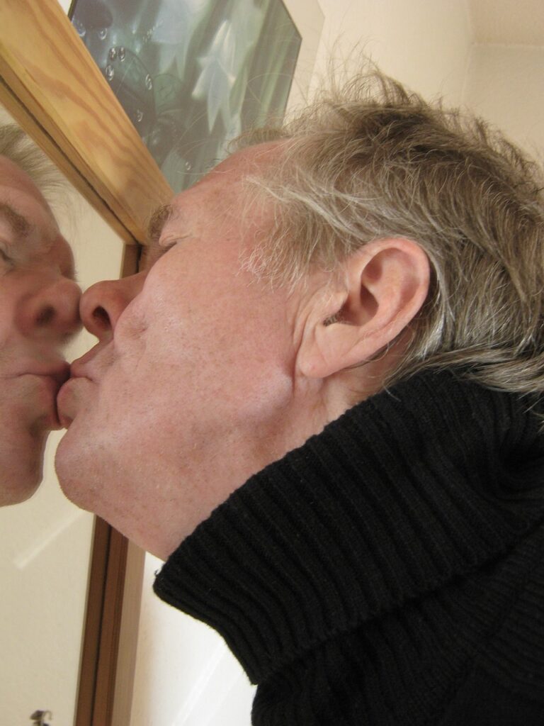 Man kissing the mirror