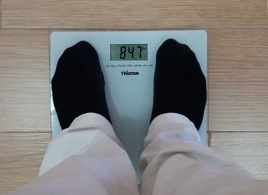 a man weighing himself