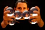 man learning how to juggle as part of experiences that all men should do before they die