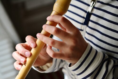 kid playing the recorder