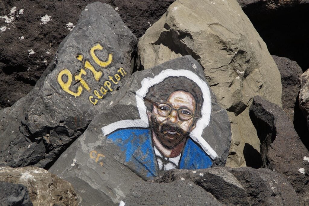 Eric Clapton picture on a Rock. He has perfect funeral songs for dad and grandpa