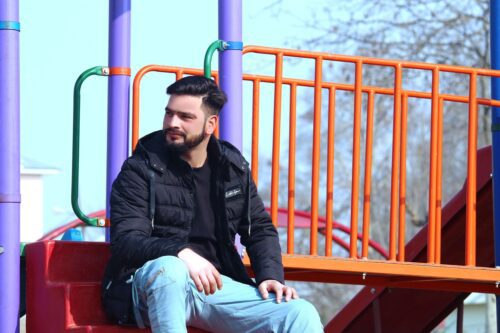 dad sitting at the playground