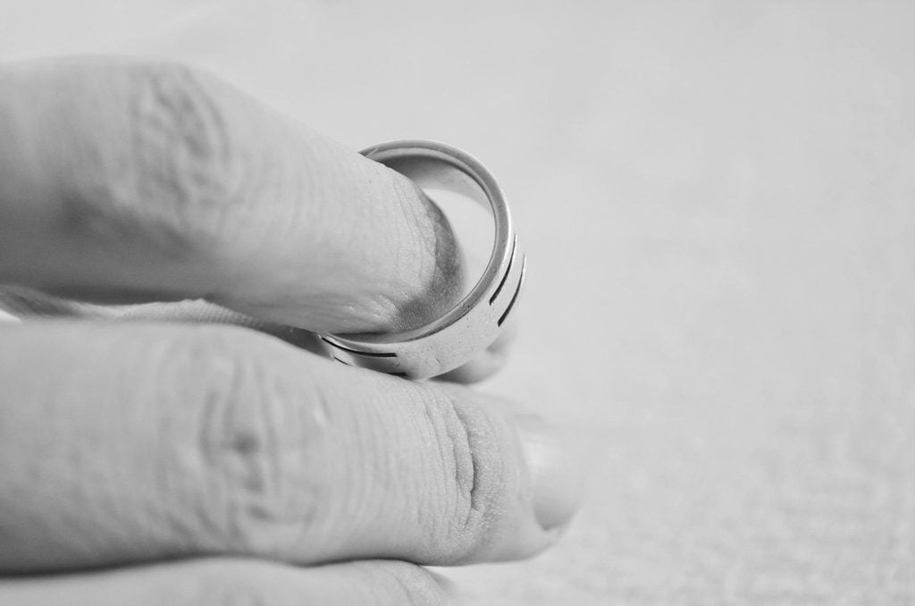 person holding wedding band